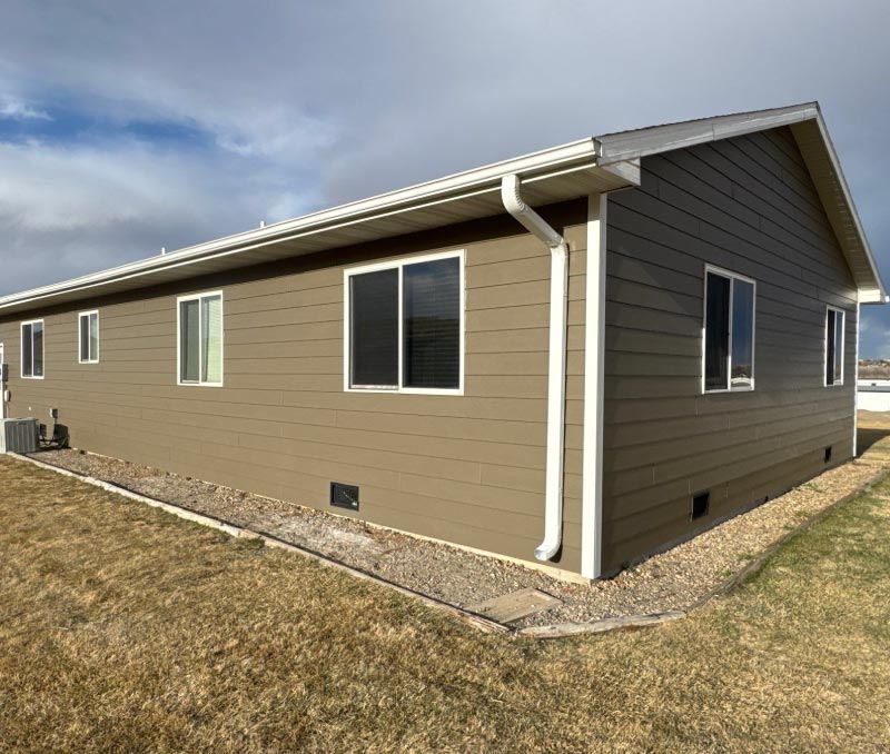 brnad-new-siding Completed residential siding project featuring high-quality, durable materials that provide enhanced protection against South Dakota storms