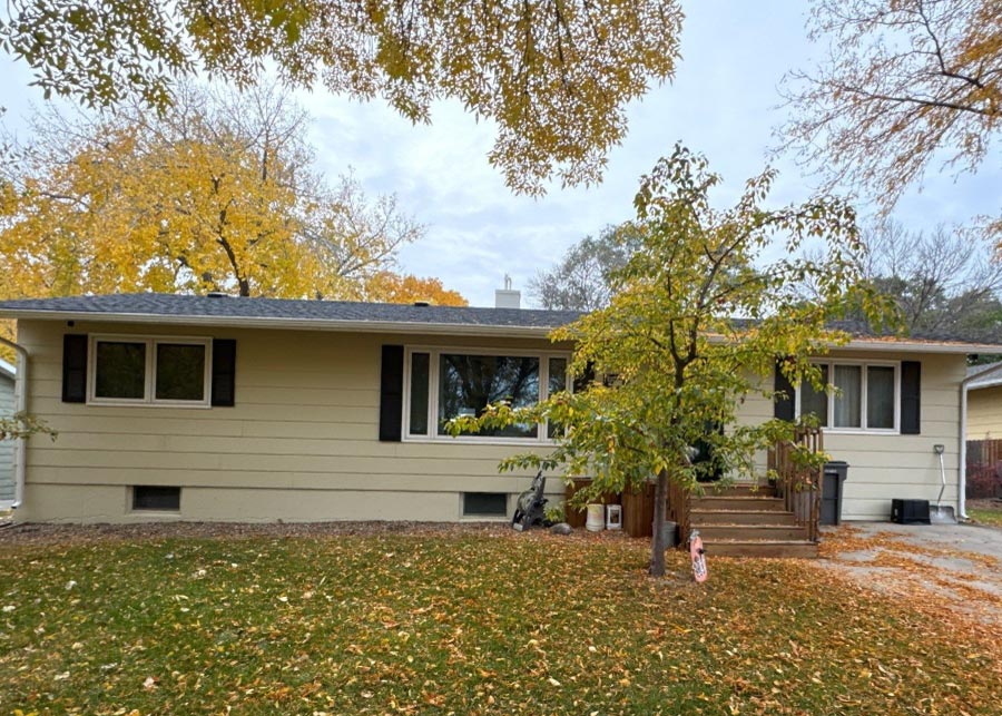 house-front Front-facing view of a residential property after a professional exterior siding renovation, showcasing a refreshed and protected home.