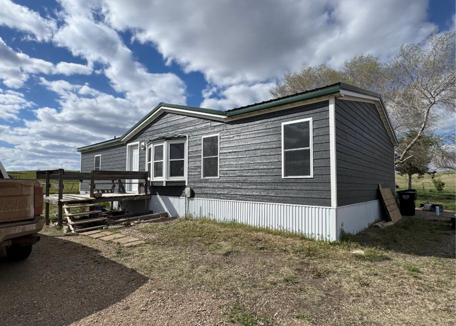 new-black-siding Contemporary home exterior featuring premium, newly installed black siding that offers a bold and sophisticated aesthetic upgrade