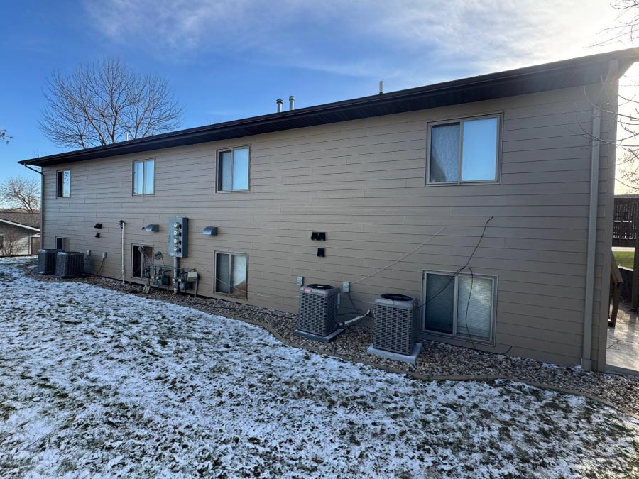 new-siding Expertly installed modern exterior siding on a residential home, showcasing clean lines and improved curb appeal.