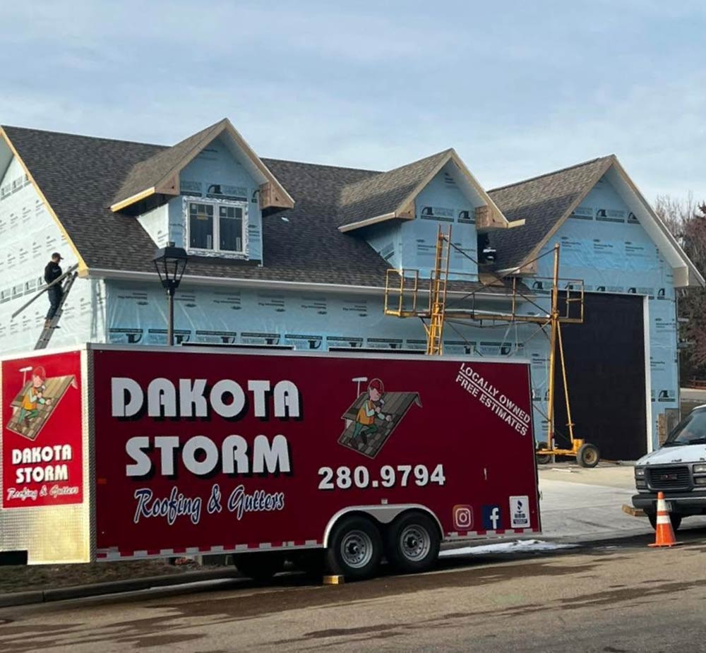 roof-company roofing in progress with the company truck in the front