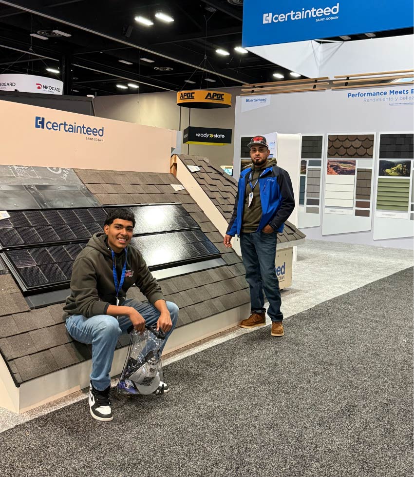 roof-expo Dakota Storm Roofing team showcasing CertainTeed solar roofing and asphalt shingles at a regional roofing expo, highlighting professional certified residential roofing installations.